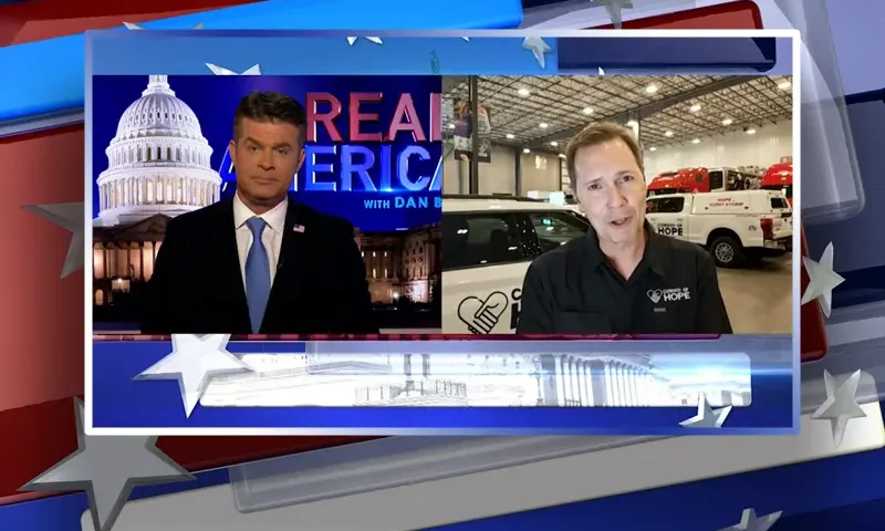 Video still from Real America on One America News Network showing a split screen of the host on the left side, and on the right side is the guest, Ethan Forhetz.