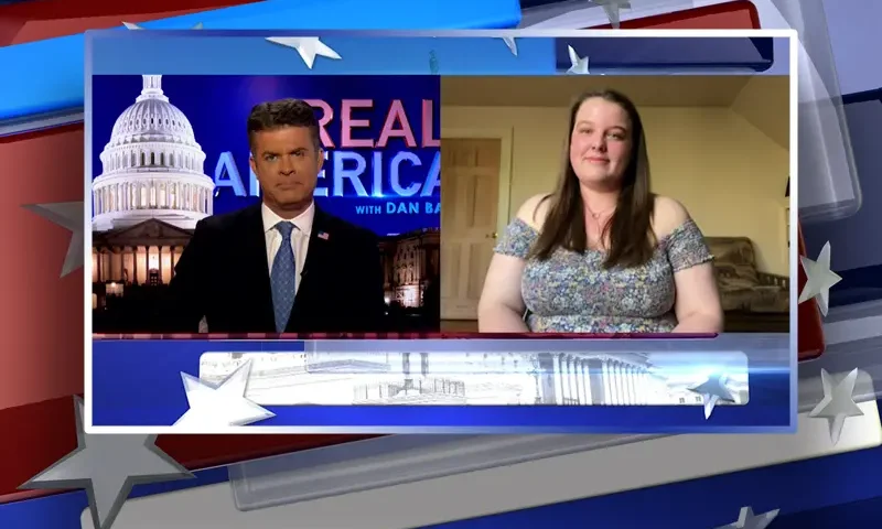 Video still from Real America on One America News Network showing a split screen of the host on the left side, and on the right side is the guest, Marcayla Amadei.