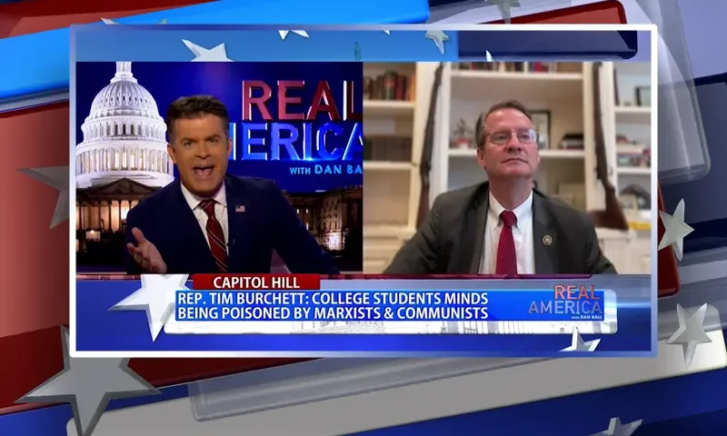 Video still from Real America on One America News Network showing a split screen of the host on the left side, and on the right side is the guest, Rep. Tim Burchett.