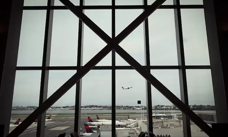 A plane takes off as seen from inside the newly completed 1.3 million-square foot $4 billion Delta Airlines Terminal C at LaGuardia Airport in the Queens borough of New York City, New York, U.S., June 1, 2022. REUTERS/Mike Segar/File Photo