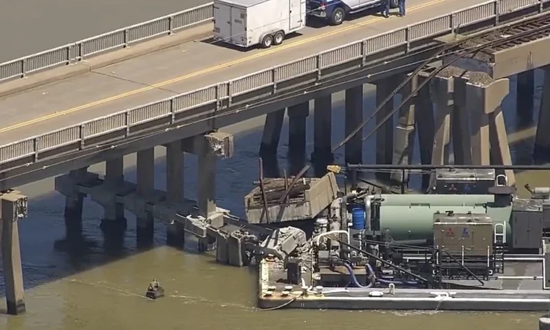 Oil spills into the surrounding waters after a barge hit a bridge in Galveston, Texas, on Wednesday, May 15, 2024. A bridge that leads to Pelican Island, located just north of Galveston, was hit by a barge around 9:30 a.m., said Ronnie Varela, with the Galveston's Office of Emergency Management.(KTRK via AP)