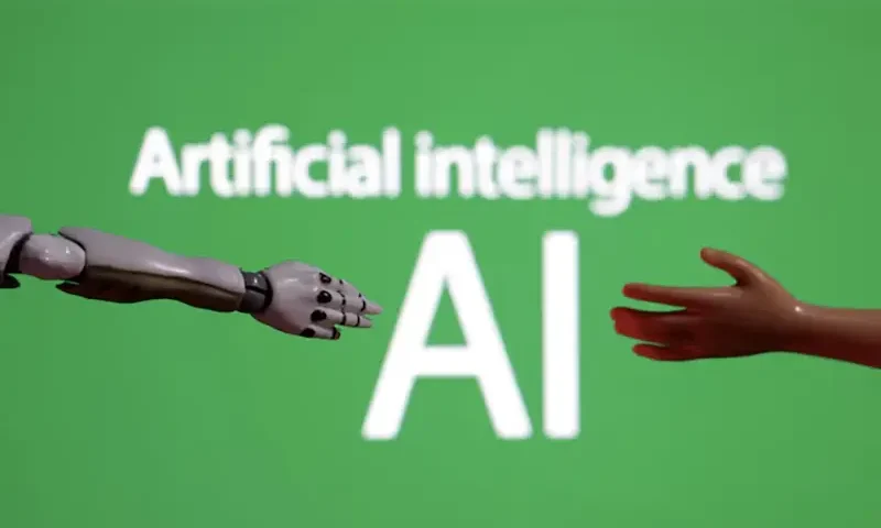 Words reading "Artificial intelligence AI", miniature of robot and toy hand are pictured in this illustration taken December 14, 2023. REUTERS/Dado Ruvic/Illustration