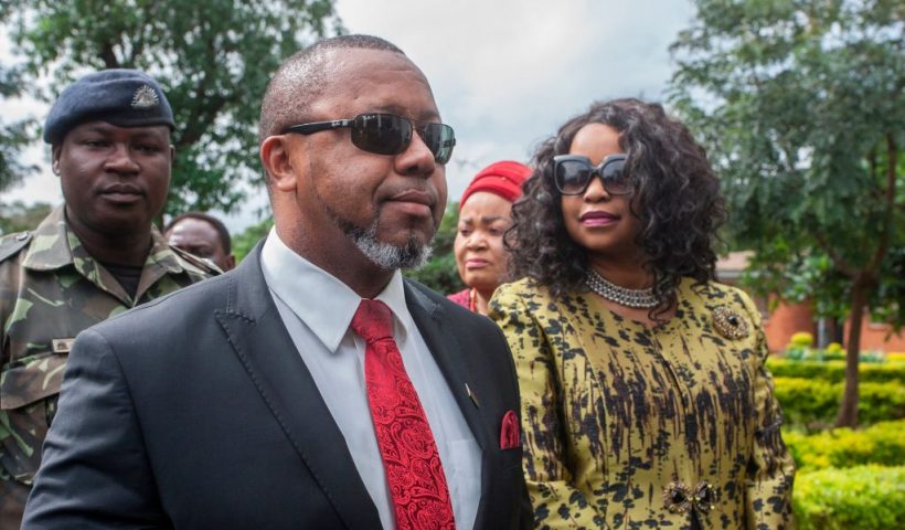 Former Malawi Vice President, Saulos Klaus Chilima (2nd L), who is now president for the United Transformation Movement (UTM) Party and who is the first petitioner in the Malawi Elecions Case, is accompanied by his wife Mary Chilima (R), waits to be screened at the Lilongwe High Court, where constitutional court judges will preside over the ruling on whether to annul the controversial vote that saw Malawi President Peter Mutharika re-elected in the May 2019 election, in Lilongwe on February 3, 2020. (Photo by AMOS GUMULIRA / AFP) (Photo by AMOS GUMULIRA/AFP via Getty Images)