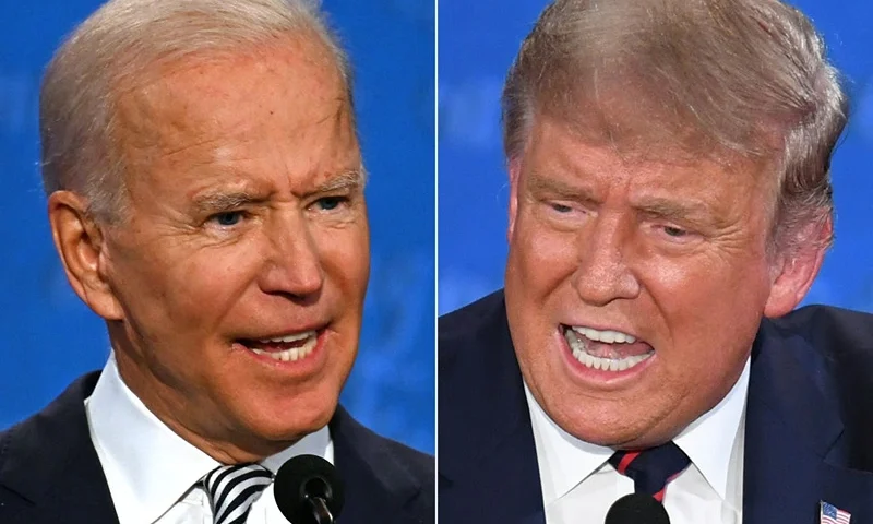 TOPSHOT - (COMBO) This combination of pictures created on September 29, 2020 shows Democratic Presidential candidate and former US Vice President Joe Biden (L) and US President Donald Trump speaking during the first presidential debate at the Case Western Reserve University and Cleveland Clinic in Cleveland, Ohio on September 29, 2020. (Photo by JIM WATSON and SAUL LOEB / AFP) (Photo by JIM WATSONSAUL LOEB/AFP via Getty Images)