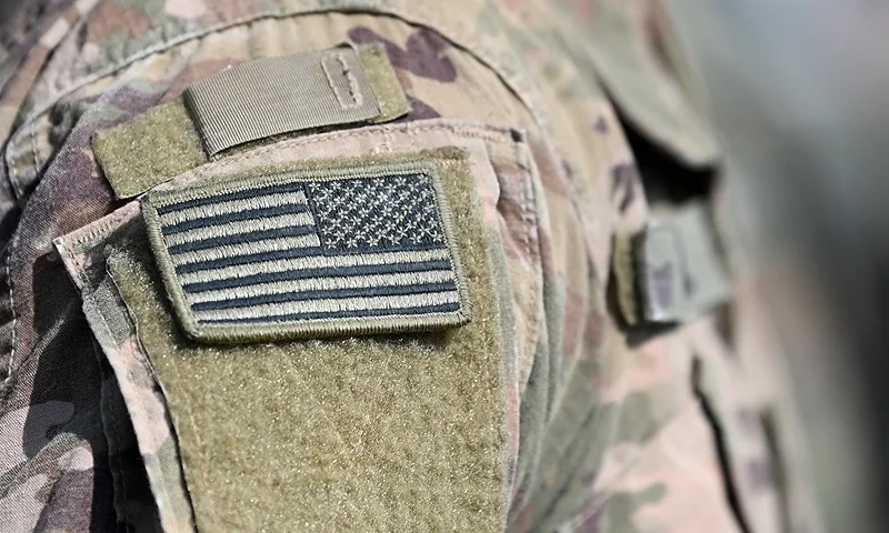 A soldier of the US army wears the country's flag on his uniform during the 'Dynamic Front 22', the US Army led NATO and Partner integrated annual artillery exercise in Europe, in Grafenwoehr, near Eschenbach, southern Germany, on July 20, 2022. The 'Dynamic Front 22' exercise, led by 56th Artillery Command, is the premier US led NATO and Partner integrated artillery exercise in Europe and includes more than 3000 participants from 19 nations. Allied artillery and supporting units practice integrating joint fires and test interoperability in a multi-national enviroment until 24 July, 2022. (Photo by Christof STACHE / AFP) (Photo by CHRISTOF STACHE/AFP via Getty Images)