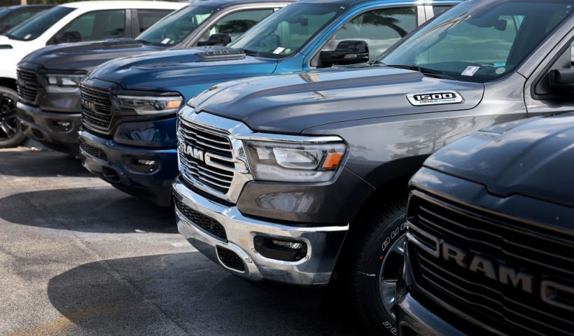 MIAMI, FLORIDA - OCTOBER 03: New Ram vehicles sit on a Dodge Chrysler-Jeep Ram dealership's lot on October 03, 2023 in Miami, Florida. U.S. automakers show a rise in sales in the third quarter even with the ongoing United Auto Workers’ union labor strikes at GM, Ford, and Chrysler-parent Stellantis and higher interest rates. (Photo by Joe Raedle/Getty Images)