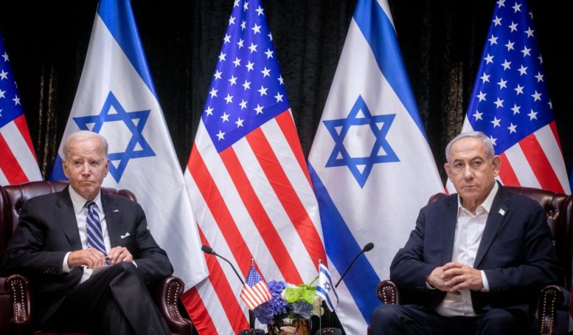 US President Joe Biden (L), sits with Israeli Prime Minister Benjamin Netanyahu, at the start of the Israeli war cabinet meeting, in Tel Aviv on October 18, 2023, amid the ongoing battles between Israel and the Palestinian group Hamas. US President Joe Biden landed in Tel Aviv on October 18, 2023 as Middle East anger flared after hundreds were killed when a rocket struck a hospital in war-torn Gaza, with Israel and the Palestinians quick to trade blame. (Photo by Miriam Alster / POOL / AFP) (Photo by MIRIAM ALSTER/POOL/AFP via Getty Images)