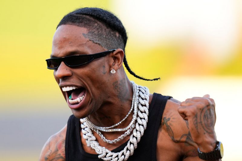 WEST PALM BEACH, FLORIDA - FEBRUARY 24: Travis Scott celebrates after throwing the opening pitch prior to a game between the Washington Nationals and the Houston Astros at CACTI Park of the Palm Beaches on February 24, 2024 in West Palm Beach, Florida. (Photo by Rich Storry/Getty Images)