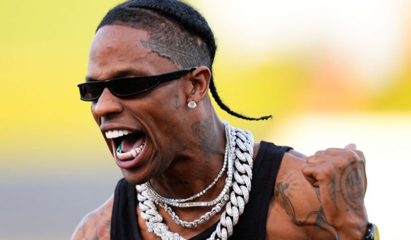 WEST PALM BEACH, FLORIDA - FEBRUARY 24: Travis Scott celebrates after throwing the opening pitch prior to a game between the Washington Nationals and the Houston Astros at CACTI Park of the Palm Beaches on February 24, 2024 in West Palm Beach, Florida. (Photo by Rich Storry/Getty Images)