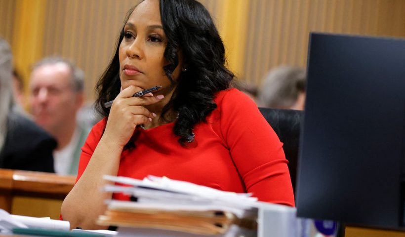Fulton County District Attorney Fani Willis listens during the final arguments in her disqualification hearing at the Fulton County Courthouse on March 1, 2024, in Atlanta, Georgia. Fulton County Superior Judge Scott McAfee is considering a motion to disqualify Willis over her romantic relationship with Special Prosecutor Nathan Wade, whom she appointed as special prosecutor in the election interference charges against former president Donald Trump. (Photo by Alex Slitz / POOL / AFP) (Photo by ALEX SLITZ/POOL/AFP via Getty Images)