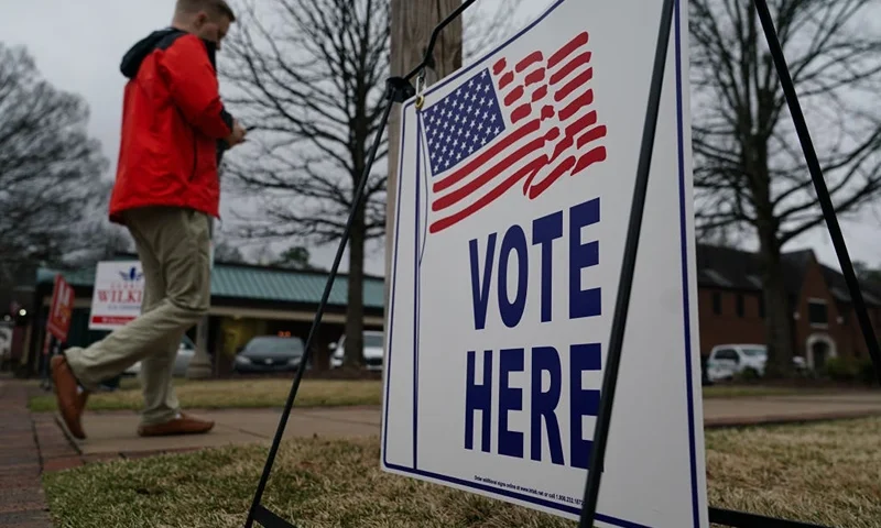 MOUNTAIN BROOK, ALABAMA - MARCH 5: A voter enters a polling place to cast their ballot in the state's primary on March 5, 2024 in Mountain Brook, Alabama. 15 States and one U.S. Territory hold their primary elections on Super Tuesday, awarding more delegates than any other day in the presidential nominating calendar. (Photo by Elijah Nouvelage/Getty Images)