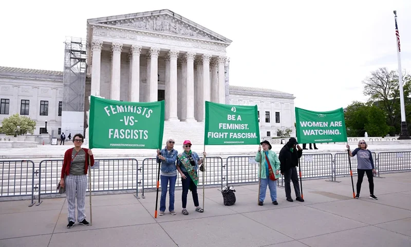 WASHINGTON, DC - APRIL 25: Women’s March activists hold a “Feminists v. Fascists” protest outside the U.S. Supreme Court as SCOTUS hears the Trump insurrection case on April 25, 2024 in Washington, DC. (Photo by Paul Morigi/Getty Images for Women's March)