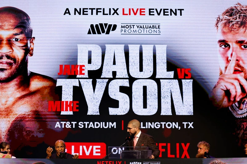 NEW YORK, NEW YORK - MAY 13: (L-R) Katie Taylor, Mike Tyson, Ariel Helwani, Jake Paul, and Amanda Serrano speak onstage at the press conference in promotion for the upcoming Jake Paul vs. Mike Tyson boxing match at The Apollo Theater on May 13, 2024 in New York City. (Photo by Sarah Stier/Getty Images for Netflix)