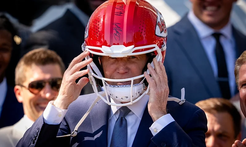 President Biden Hosts Super Bowl Champion Kansas City Chiefs At White House WASHINGTON, DC - MAY 31: U.S. President Joe Biden puts on a team helmet presented to him by the NFL Kansas City Chiefs on the South Lawn of the White House on May 31, 2024 in Washington, DC. President Biden hosted the Chiefs to honor their 2024 Super Bowl win. (Photo by Andrew Harnik/Getty Images)