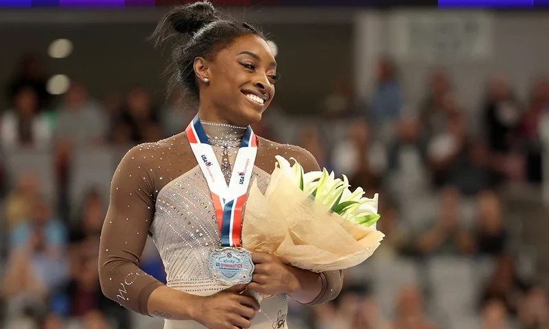 2024 Xfinity U.S. Gymnastics Championships FORT WORTH, TEXAS - JUNE 02: First place all around winner Simone Biles celebrates after the 2024 Xfinity U.S. Gymnastics Championships at Dickies Arena on June 02, 2024 in Fort Worth, Texas. (Photo by Elsa/Getty Images)