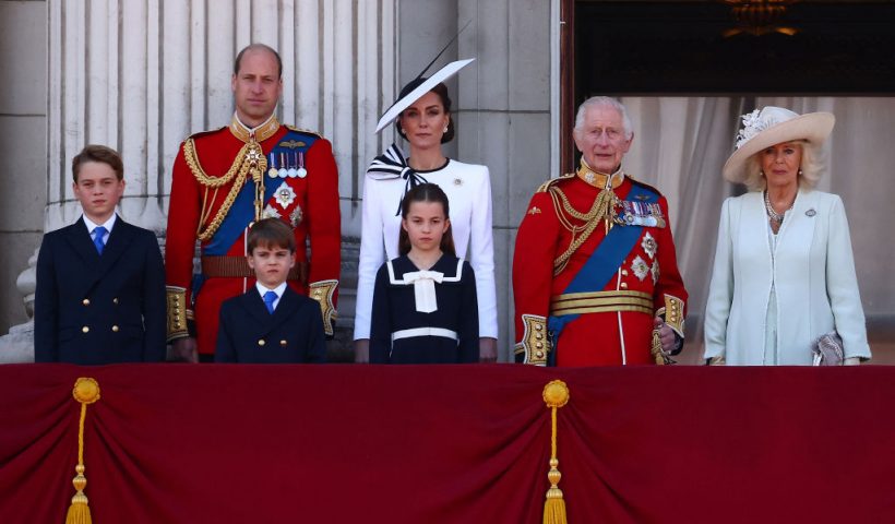 TOPSHOT - (L-R) Britain's Prince George of Wales, Britain's Prince William, Prince of Wales, Britain's Prince Louis of Wales, Britain's Catherine, Princess of Wales, Britain's Princess Charlotte of Wales, Britain's King Charles III and Britain's Queen Camilla stand on the balcony of Buckingham Palace after attending the King's Birthday Parade "Trooping the Colour" in London on June 15, 2024. The ceremony of Trooping the Colour is believed to have first been performed during the reign of King Charles II. Since 1748, the Trooping of the Colour has marked the official birthday of the British Sovereign. Over 1500 parading soldiers and almost 300 horses take part in the event. (Photo by HENRY NICHOLLS / AFP) (Photo by HENRY NICHOLLS/AFP via Getty Images)
