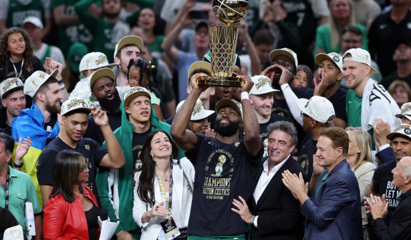 BOSTON, MASSACHUSETTS - JUNE 17: Jaylen Brown #7 of the Boston Celtics holds up the Larry O'Brien trophy after Boston's 106-88 win against the Dallas Mavericks in Game Five of the 2024 NBA Finals at TD Garden on June 17, 2024 in Boston, Massachusetts. NOTE TO USER: User expressly acknowledges and agrees that, by downloading and or using this photograph, User is consenting to the terms and conditions of the Getty Images License Agreement. (Photo by Adam Glanzman/Getty Images)