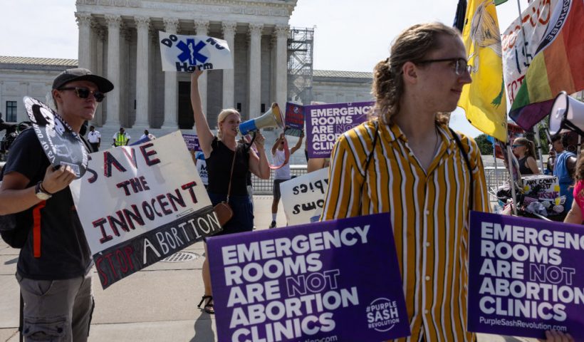 WASHINGTON, DC - JUNE 26: Anti-abortion demonstrators gather in front of the Supreme Court on June 26, 2024 in Washington, DC. A ruling is expected this week in the case of Moyle v. United States, which will determine if hospitals in states with abortion bans will be required by law to provide abortion procedures in emergency situations. (Photo by Anna Rose Layden/Getty Images)