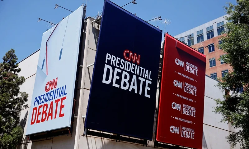 ATLANTA, GEORGIA - JUNE 25: Signs advertising the presidential debate hosted by CNN are seen outside of their studios on June 25, 2024 in Atlanta, Georgia. U.S. President Joe Biden and Republican presidential candidate former President Donald Trump will face off in the first presidential debate of the 2024 presidential cycle this Thursday. (Photo by Kevin Dietsch/Getty Images)