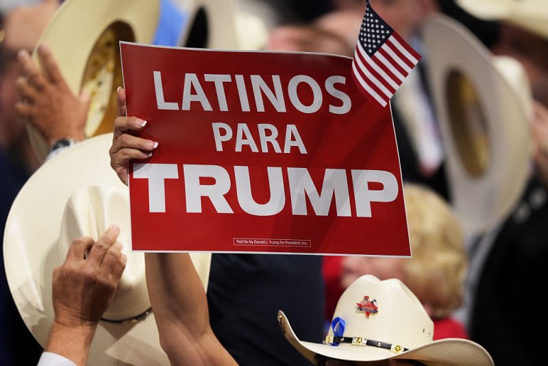 CLEVELAND, OH - JULY 21: A delegate holds up sign that reads "Latinos Para Trump" during the evening session on the fourth day of the Republican National Convention on July 21, 2016 at the Quicken Loans Arena in Cleveland, Ohio. Republican presidential candidate Donald Trump received the number of votes needed to secure the party's nomination. An estimated 50,000 people are expected in Cleveland, including hundreds of protesters and members of the media. The four-day Republican National Convention kicked off on July 18. (Photo by Jeff Swensen/Getty Images)