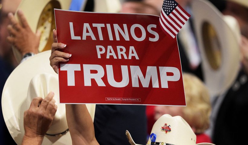 CLEVELAND, OH - JULY 21: A delegate holds up sign that reads "Latinos Para Trump" during the evening session on the fourth day of the Republican National Convention on July 21, 2016 at the Quicken Loans Arena in Cleveland, Ohio. Republican presidential candidate Donald Trump received the number of votes needed to secure the party's nomination. An estimated 50,000 people are expected in Cleveland, including hundreds of protesters and members of the media. The four-day Republican National Convention kicked off on July 18. (Photo by Jeff Swensen/Getty Images)