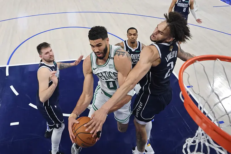 Boston Celtics forward Jayson Tatum (0) battles for the ball against Dallas Mavericks center Dereck Lively II (2) during the second quarter during game three of the 2024 NBA Finals at American Airlines Center. Mandatory Credit: Stacy Revere/Pool Photo-USA TODAY Sports