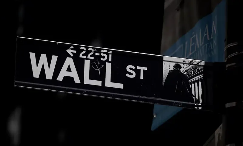 A Wall St. street sign is seen near the New York Stock Exchange (NYSE) in New York City, U.S., September 17, 2019. REUTERS/Brendan McDermid/File Photo