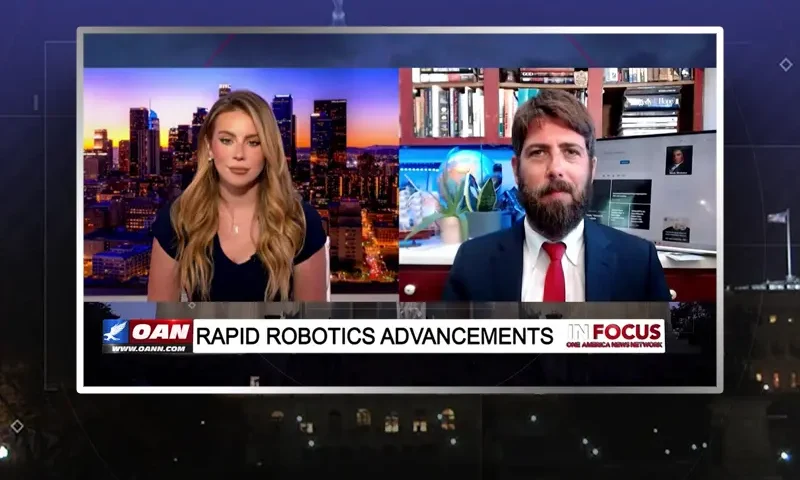Video still from In Focus on One America News Network showing a split screen of the host on the left side, and on the right side is the guest, Alex Newman.
