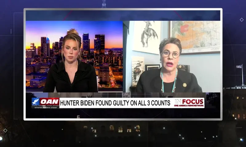 Video still from In Focus on One America News Network showing a split screen of the host on the left side, and on the right side is the guest, Harriet Hageman.