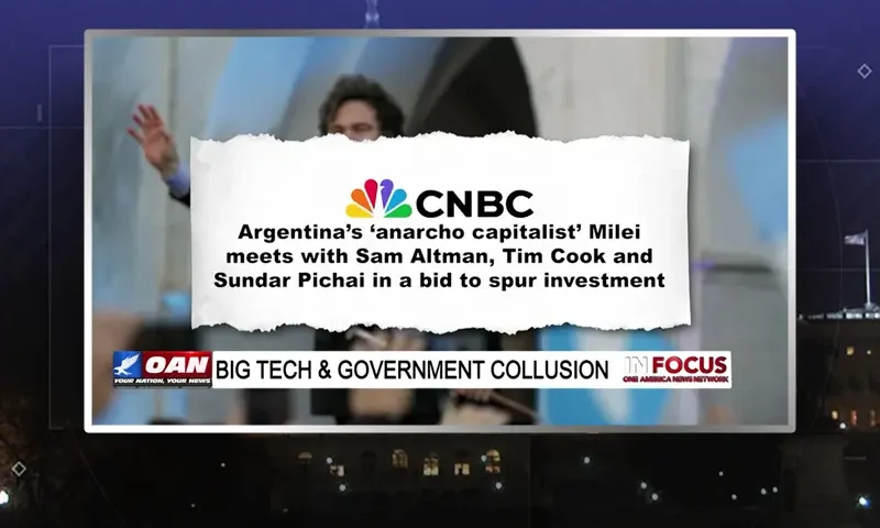 Video still of the host of In Focus at the desk of their talk show on One America News Network.