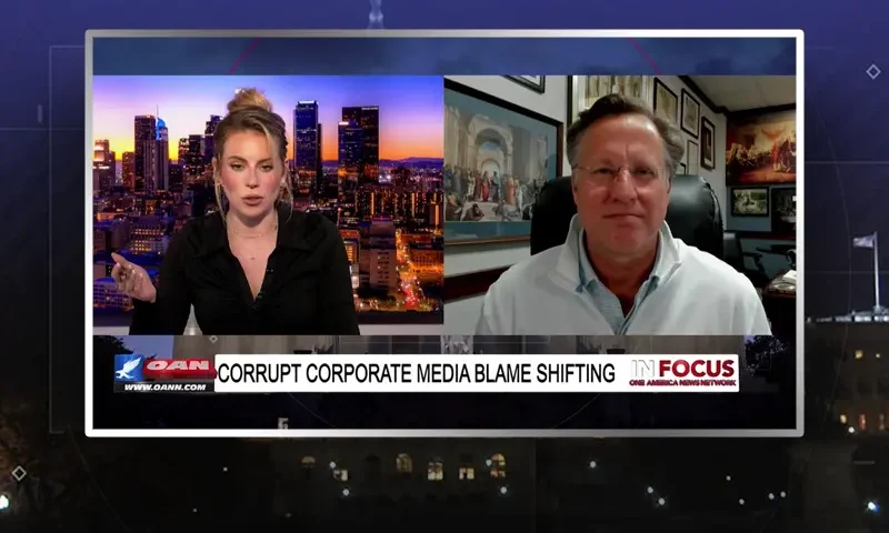 Video still from In Focus on One America News Network showing a split screen of the host on the left side, and on the right side is the guest, Dr. Dave Brat.