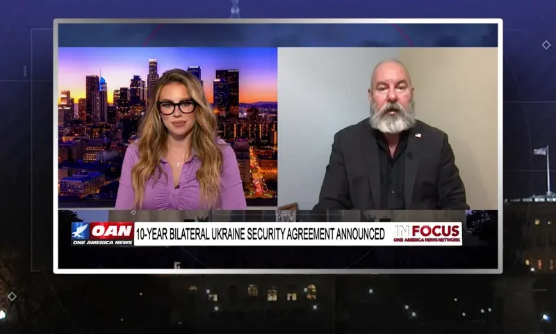 Video still from In Focus on One America News Network showing a split screen of the host on the left side, and on the right side is the guest, Jonathan Gillium.