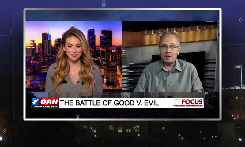 Video still from In Focus on One America News Network showing a split screen of the host on the left side, and on the right side is the guest, Troy Anderson.