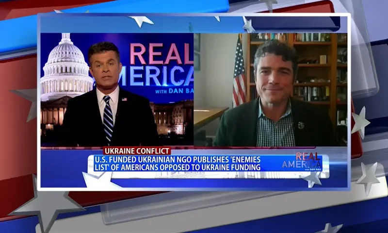 Video still from Real America on One America News Network showing a split screen of the host on the left side, and on the right side is the guest, Joe Kent.