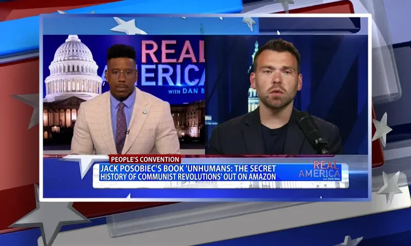 Video still from Real America on One America News Network showing a split screen of the host on the left side, and on the right side is the guest, Jack Posobiec.
