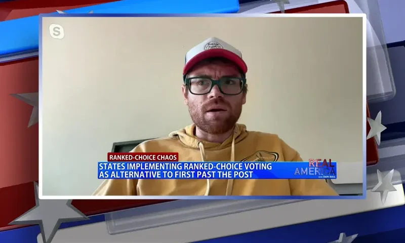 Video still from Real America on One America News Network during an interview with the guest, Phil Izon.
