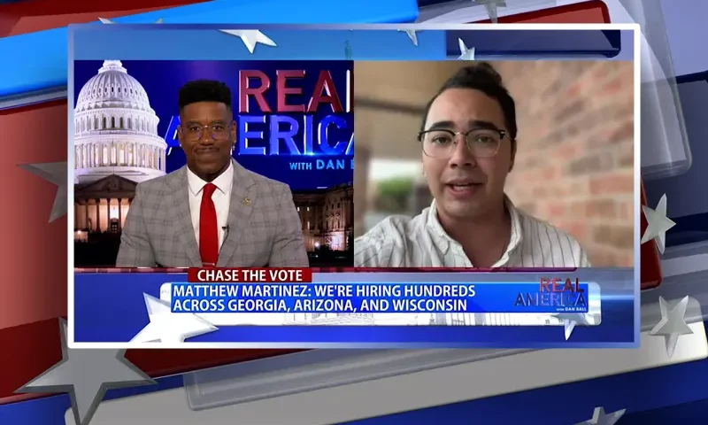 Video still from Real America on One America News Network showing a split screen of the host on the left side, and on the right side is the guest, Matthew Martinez.