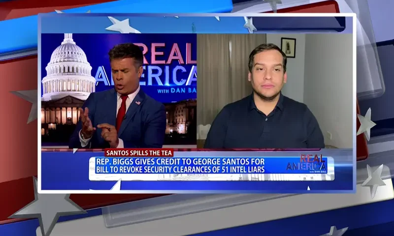 Video still from Real America on One America News Network showing a split screen of the host on the left side, and on the right side is the guest, George Santos.