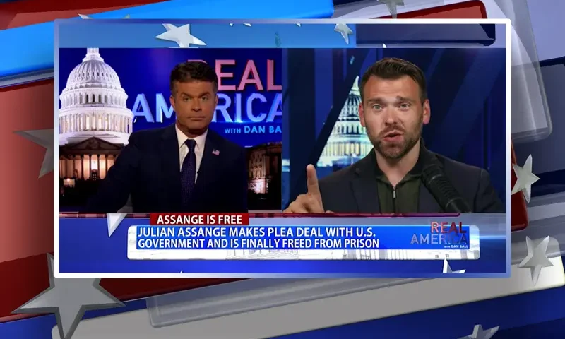Video still from Real America on One America News Network showing a split screen of the host on the left side, and on the right side is the guest, Jack Posobiec.