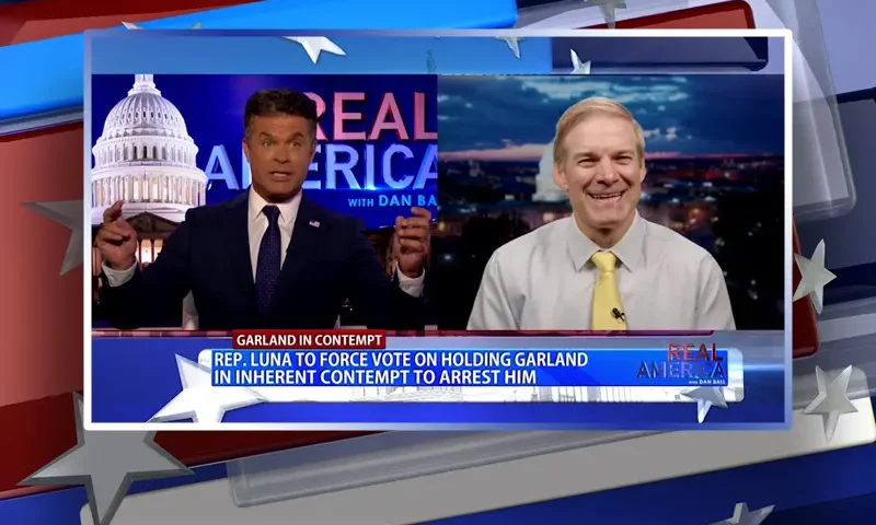 Video still from Real America on One America News Network showing a split screen of the host on the left side, and on the right side is the guest, Rep. Jim Jordan.