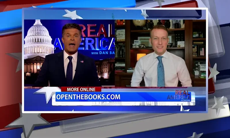 Video still from Real America on One America News Network showing a split screen of the host on the left side, and on the right side is the guest, Adam Andrzejewski.