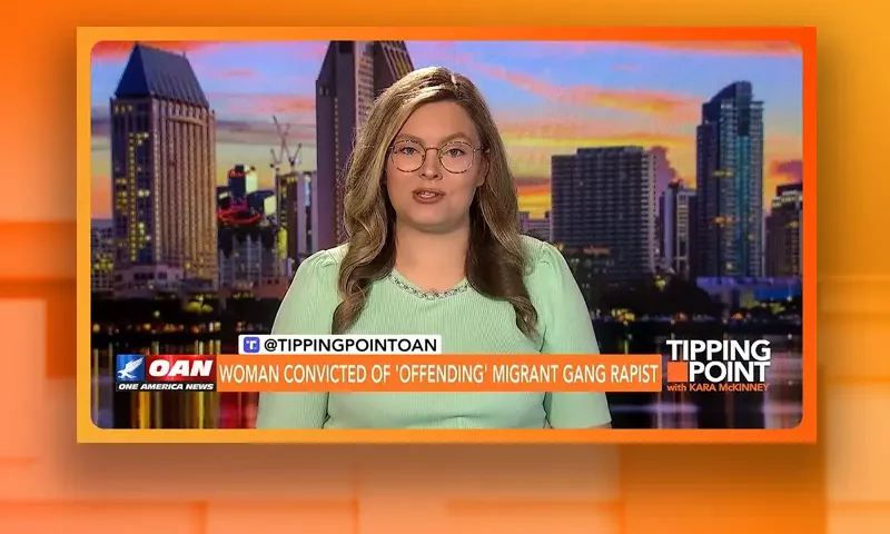 Video still of the host of Tipping Point at the desk of their talk show on One America News Network.