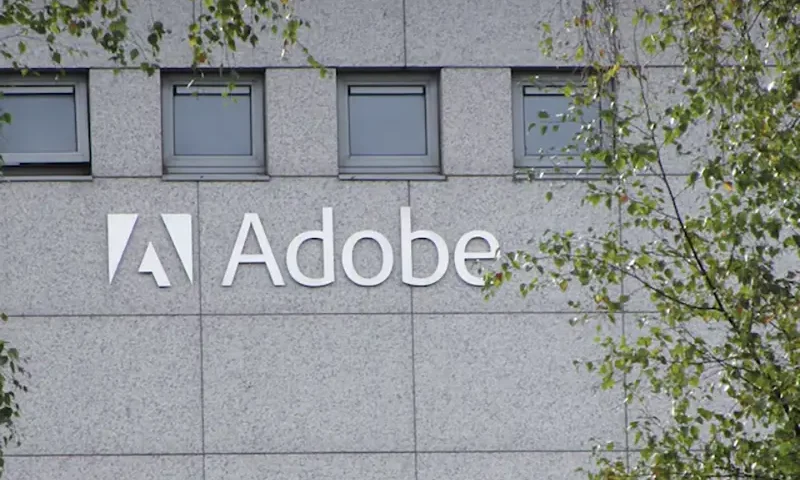 A logo of Adobe Inc. is pictured at the company's office in Citywest Business Campus, Saggart, Ireland October 19, 2021. Picture taken October 19, 2021. REUTERS/ Tom Bergin/File Photo