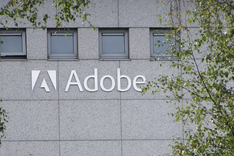 A logo of Adobe Inc. is pictured at the company's office in Citywest Business Campus, Saggart, Ireland October 19, 2021. Picture taken October 19, 2021. REUTERS/ Tom Bergin/File Photo