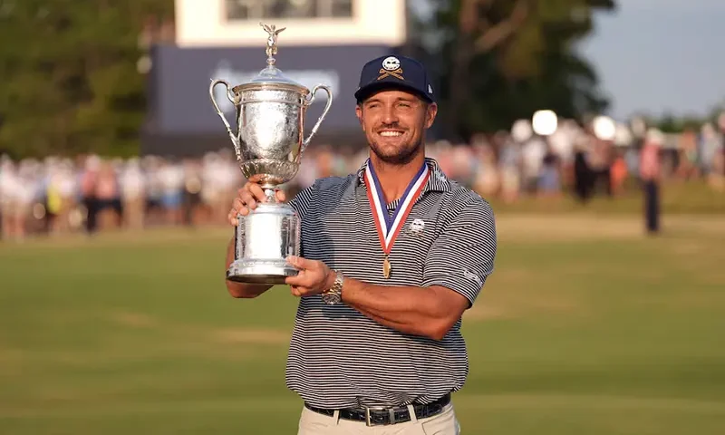 Bryson DeChambeau celebrates with the trophy after winning the U.S. Open golf tournament. Jim Dedmon-USA TODAY Sports