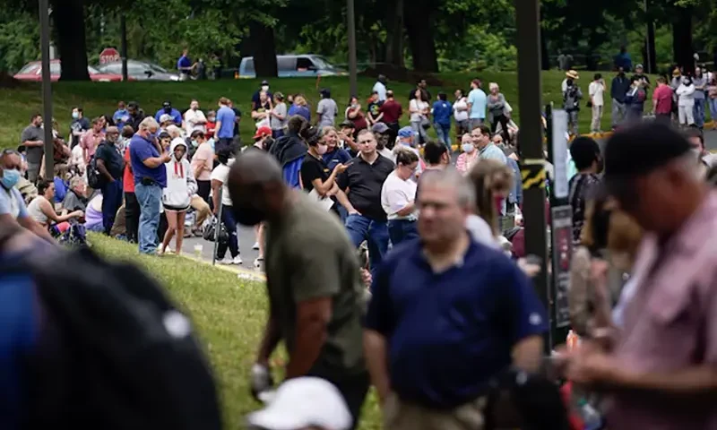 Hundreds of people line up outside a Kentucky Career Center hoping to find assistance with their unemployment claim in Frankfort, Kentucky, U.S. June 18, 2020. REUTERS/Bryan Woolston