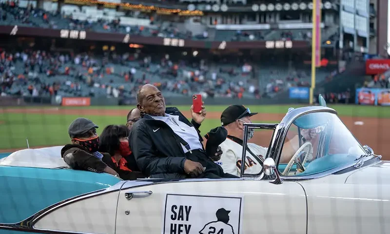San Francisco Giants retired center fielded Willie Mays (24) celebrates his 90th birthday with fans at Oracle Park before the start of the game against the San Diego Padres. Mandatory Credit: Neville E. Guard-USA TODAY Sports