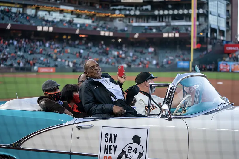 San Francisco Giants retired center fielded Willie Mays (24) celebrates his 90th birthday with fans at Oracle Park before the start of the game against the San Diego Padres. Mandatory Credit: Neville E. Guard-USA TODAY Sports