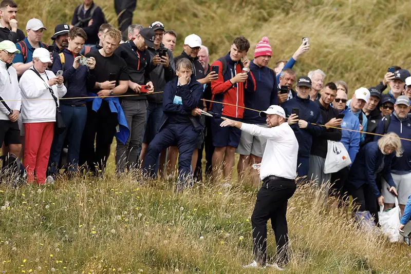 Ireland's Shane Lowry gestures by his ball in the rough on the 6th hole during the second round REUTERS/Jason Cairnduff