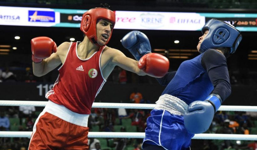Algeria's Imane Khalif (Red) fights against Tunisia's Homrani Ep Zayani Mariem (Blue) during the women's Fly finals at the Dakar arena on February 29, 2020 in Dakar, Senegal. - 320 boxers from 39 African countries will fight for a spot in the 2020 Tokyo Olympic games. (Photo by Seyllou / AFP) (Photo by SEYLLOU/AFP via Getty Images)